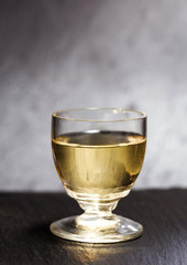 liquer glass over slate background
