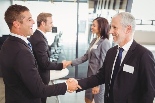 Businesspeople shaking hands with each other