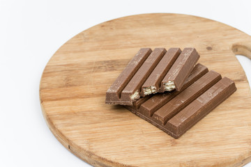 Chocolate bars on the wooden board