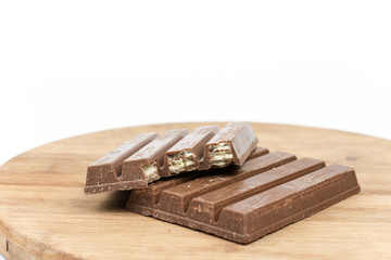 Chocolate bars on the wooden board