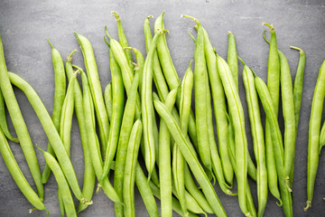 Green beans  on a gray background.