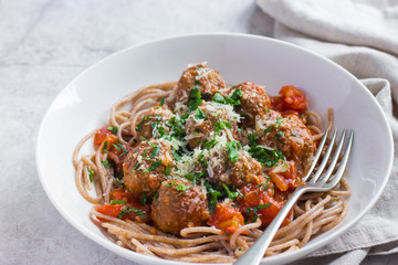 Whole grain spaghetti pasta  with beef meatballs and tomato sauc