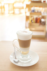 Cup of Hot  Latte Coffee on wood table