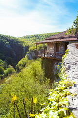 Fototapeta na wymiar House on cliff in green mountains near Kutaisi Svaneti Georgia.