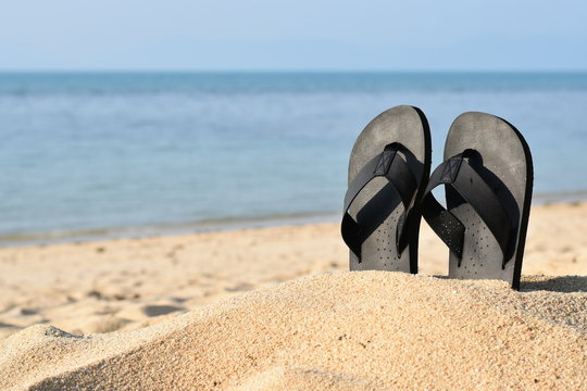 Summer vacation concept--Flipflops on a sandy ocean beach