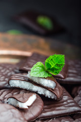 Chocolate peppermint cookies.Mint. Peppermint. Menthol. Black chocolate with peppermint cream. Black chocolate with mint stuffing. Menthol chocolate with mint leaves. Toned images.