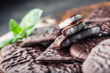 Chocolate peppermint cookies.Mint. Peppermint. Menthol. Black chocolate with peppermint cream. Black chocolate with mint stuffing. Menthol chocolate with mint leaves. Toned images.