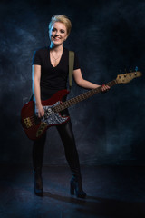 Rock star playing bass guitar