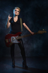 Fototapeta premium Rock star playing bass guitar