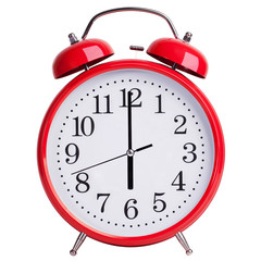 Round alarm clock shows exactly six