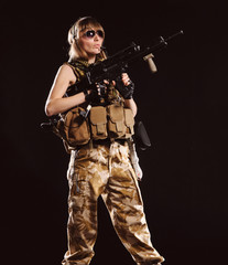 Fototapeta premium Beautiful army girl with gun
