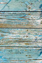 Blue fence with stripes in natural light