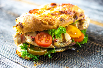 Delicious sandwich with grilled chicken and fresh crunchy vegetables