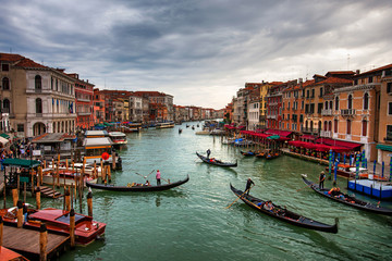 Fototapeta na wymiar Boats and gondolas with tourists on the Grand Canal, Venice.