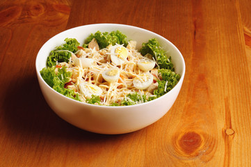 Fresh salad with chicken breast, cheese and eggs