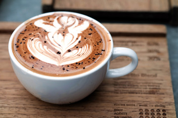 Hot coffee on a tray on the table.