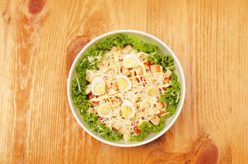 Fresh salad with chicken breast, cheese and eggs