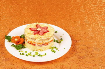Fresh salad with mayonnaise, sausage,  potatoes, pepper