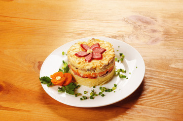 Fresh salad with mayonnaise, sausage,  potatoes, pepper