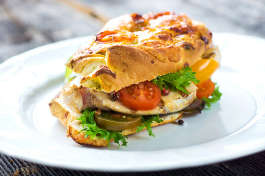 Delicious sandwich with grilled chicken and fresh crunchy vegetables
