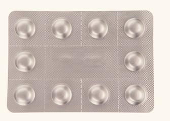 Pack of pills isolated over white background