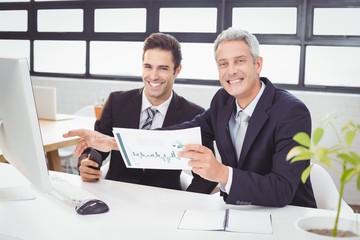 Portrait of business people working at computer desk