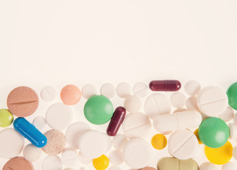 Heap of pills on grey background