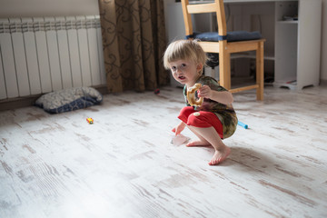 little boy  child toddler plays  at home casual lifestyle photo series in real life interior