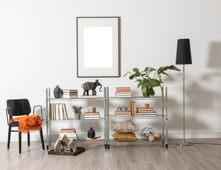 white wall, frame and metallic shelf