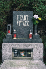 Heart attack as civilization disease. Gravestone with text Heart Attack. Metaphor of victims who died or disease eradication by progress in medicine. - obrazy, fototapety, plakaty