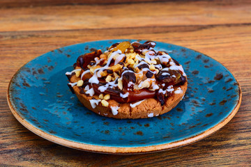 Homemade Cakes: Cake on Plate with Nuts, Chocolate and Raisins.