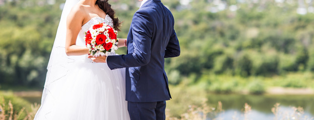 Bride and groom on their wedding day outdoors
