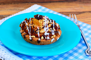 Homemade Cakes: Cake on Plate with Nuts, Chocolate and Raisins.