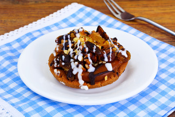 Homemade Cakes: Cake on Plate with Nuts, Chocolate and Raisins.