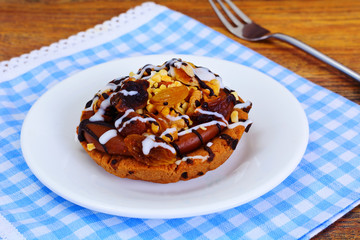 Homemade Cakes: Cake on Plate with Nuts, Chocolate and Raisins.