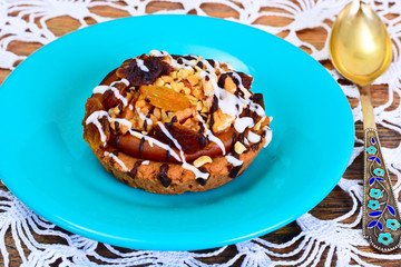 Homemade Cakes: Cake on Plate with Nuts, Chocolate and Raisins.