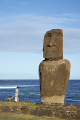 Weathered Moai statue on the coast of Rapa Nui (Easter Island) in the capital Hanga Roa.