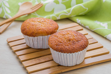Banana cupcake on wooden plate