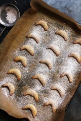 Crescent cookies on dark moody background, selective focus