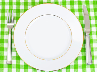 White Plate on a Checkered Tablecloth with Place for Your Text