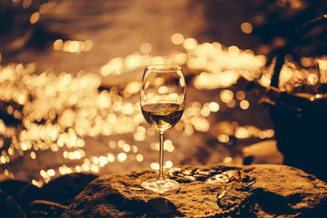 Winwe glass near water