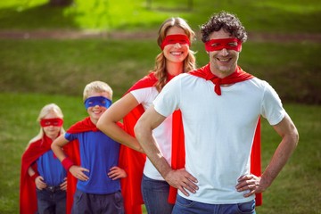 Happy family pretending to be superhero