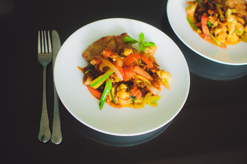 vegetables tomato, carrot, pepper,green beans on white plate