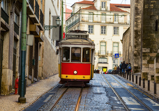 Romantic Lisbon street with the typical tram and Lisbon © aiisha