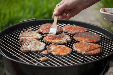 Hot burgers on BBQ grill