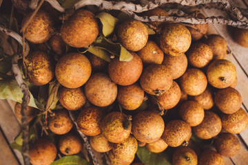 lychee - Litchi chinensis closeup on brown board background
