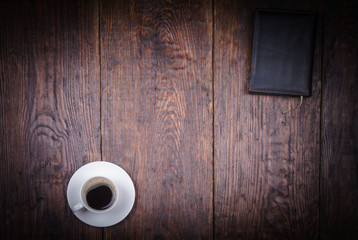 cup of coffee on a wooden background