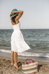 Woman relaxing at the seaside.