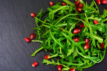 Fresh Arugula on Black background.