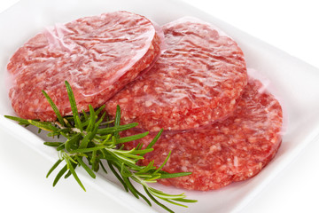 Raw hamburgers.